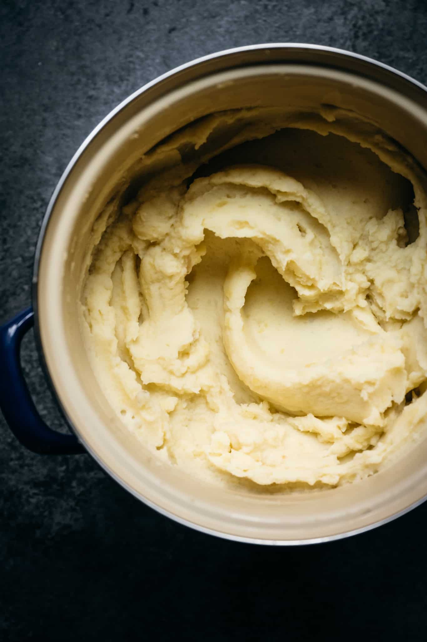 overhead of creamy vegan mashed potatoes in a large pot