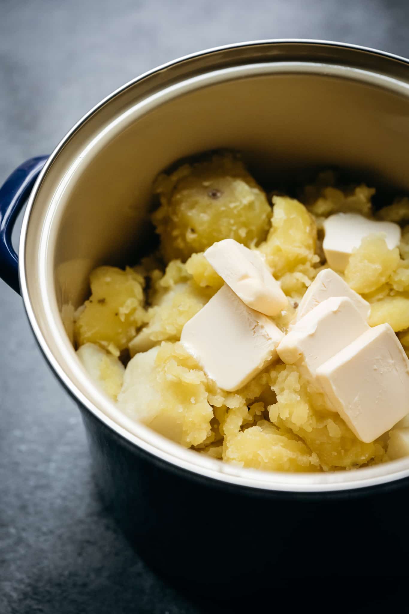 side view of boiled potatoes with vegan butter