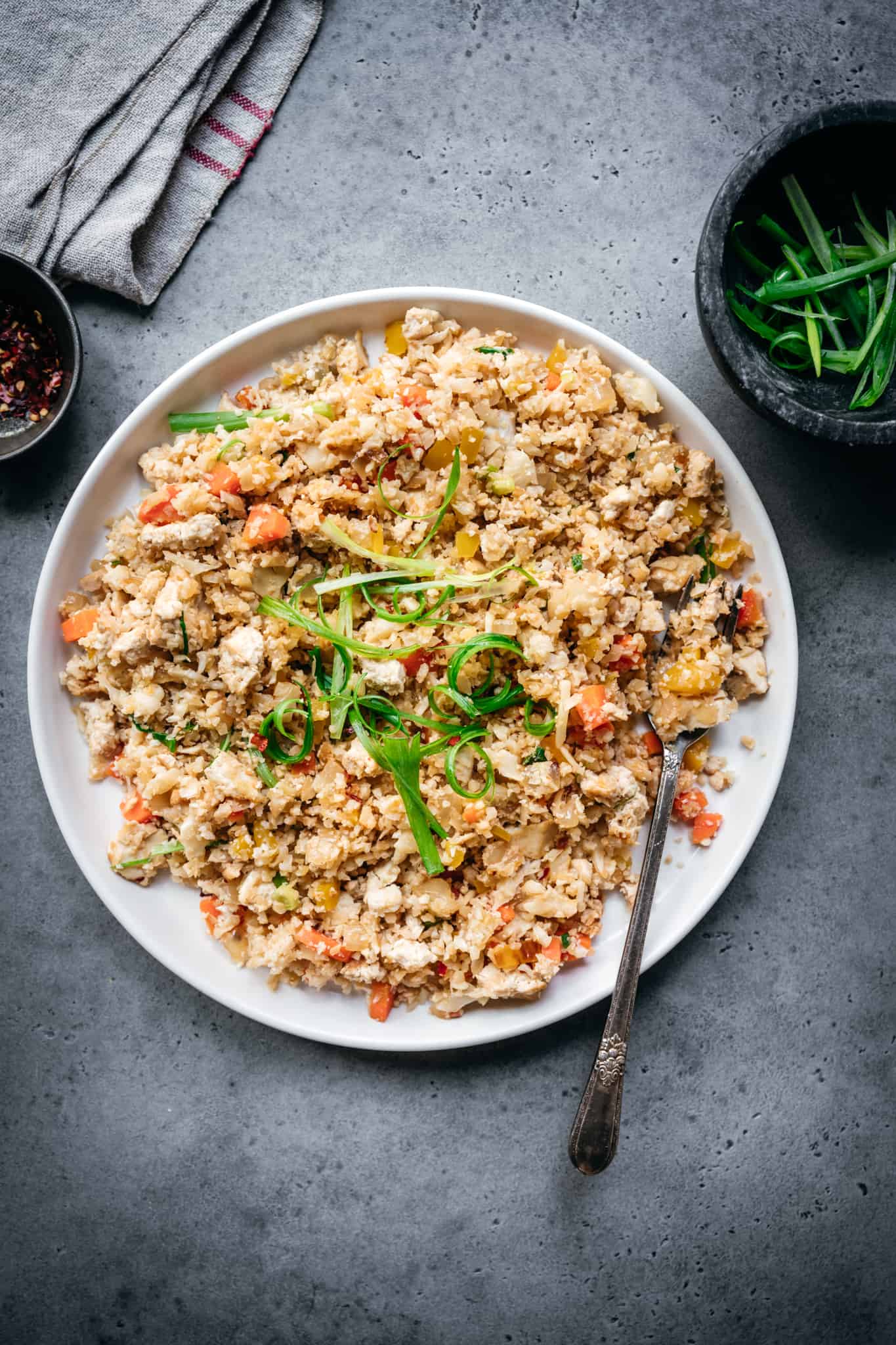 overhead of vegan cauliflower fried rice on a white plate