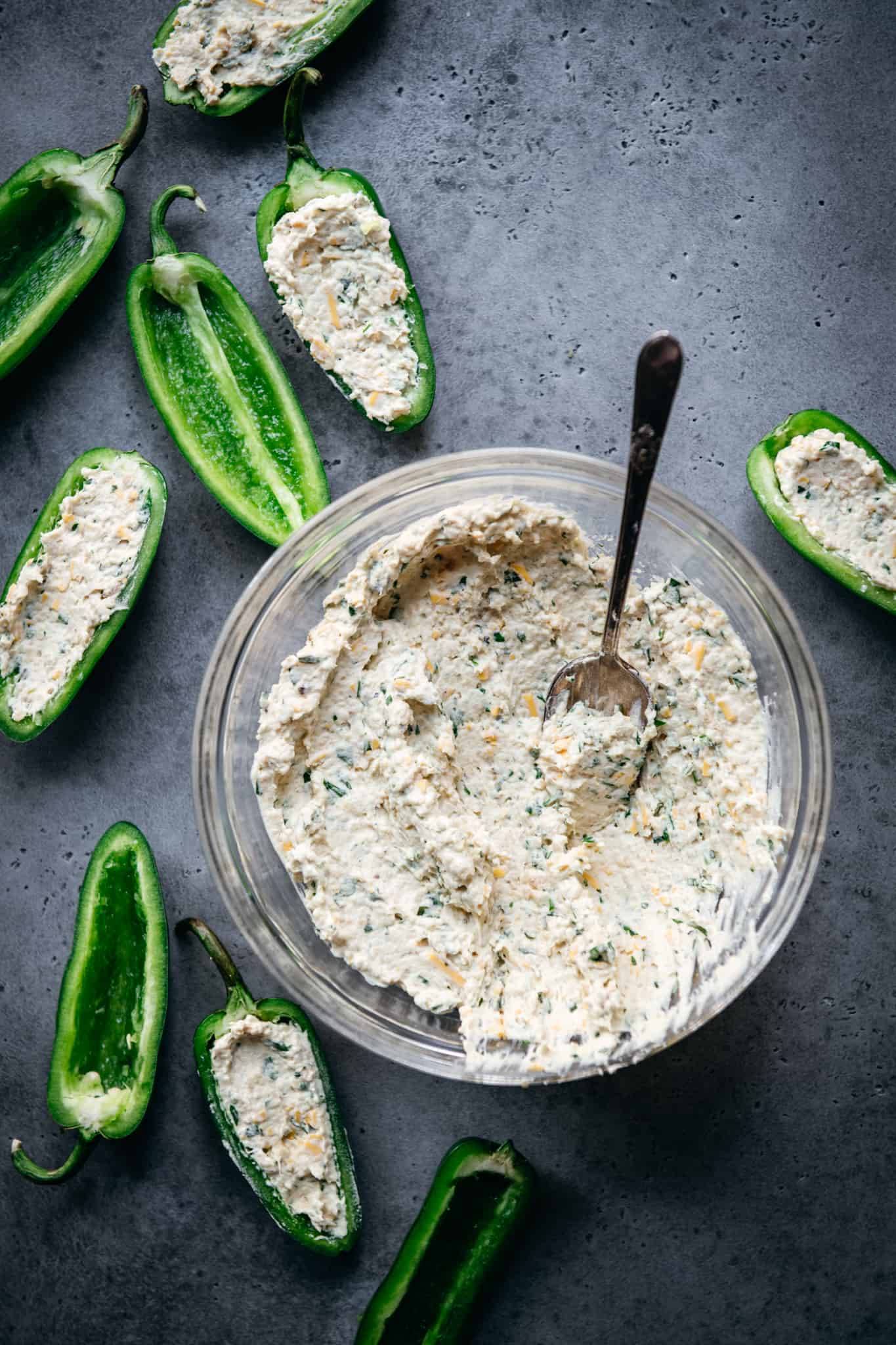 overhead of a bowl of vegan cheese filling for jalapeño peppers