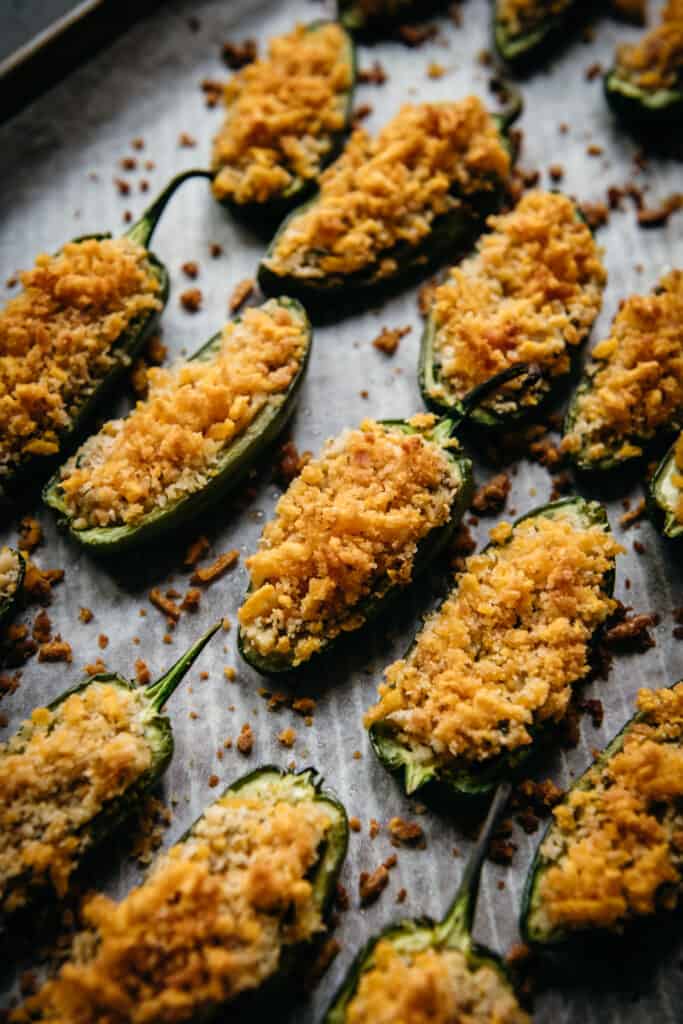 overhead of vegan jalapeno poppers on a baking sheet