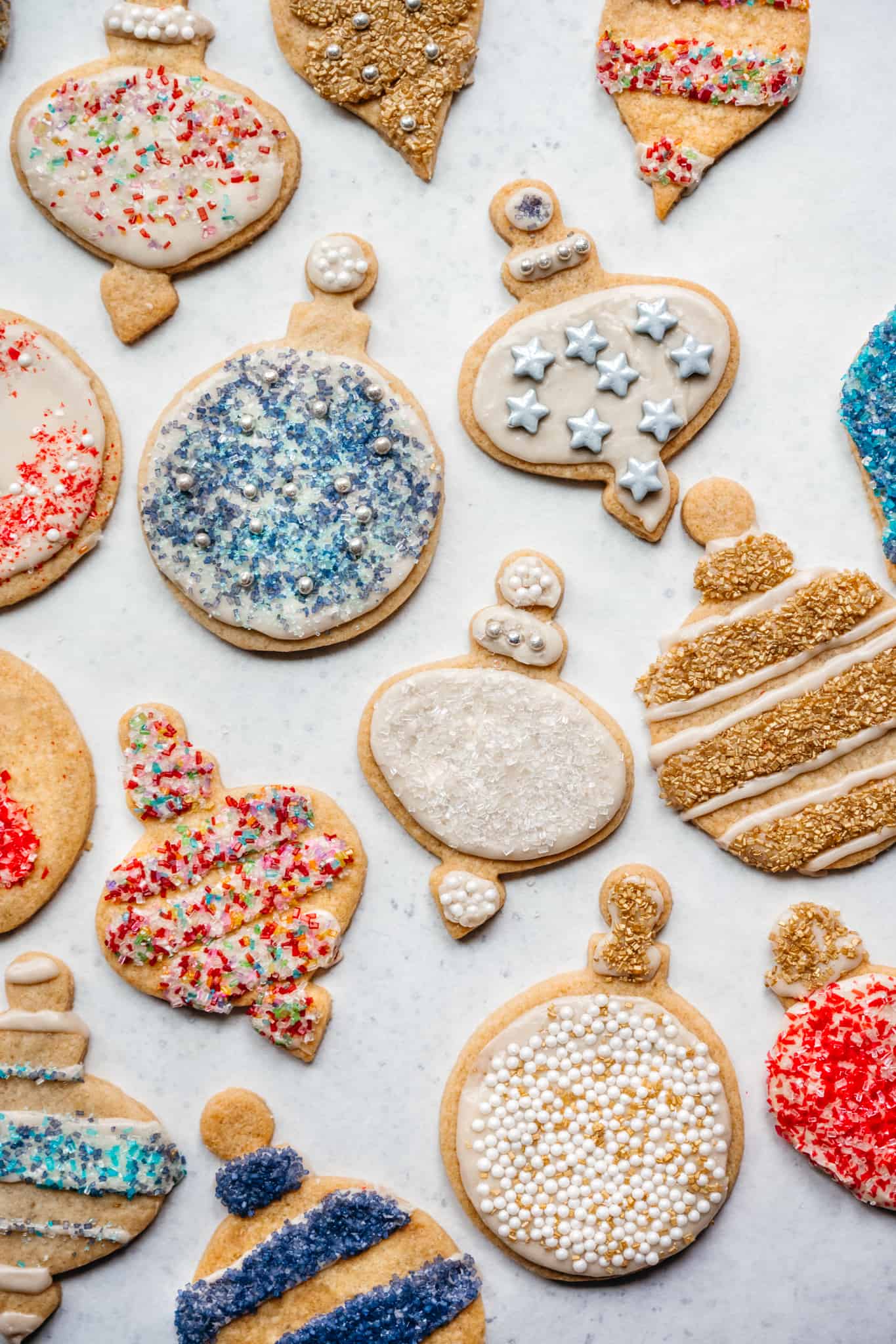 overhead view of vegan gluten free sugar cookies with christmas decorations