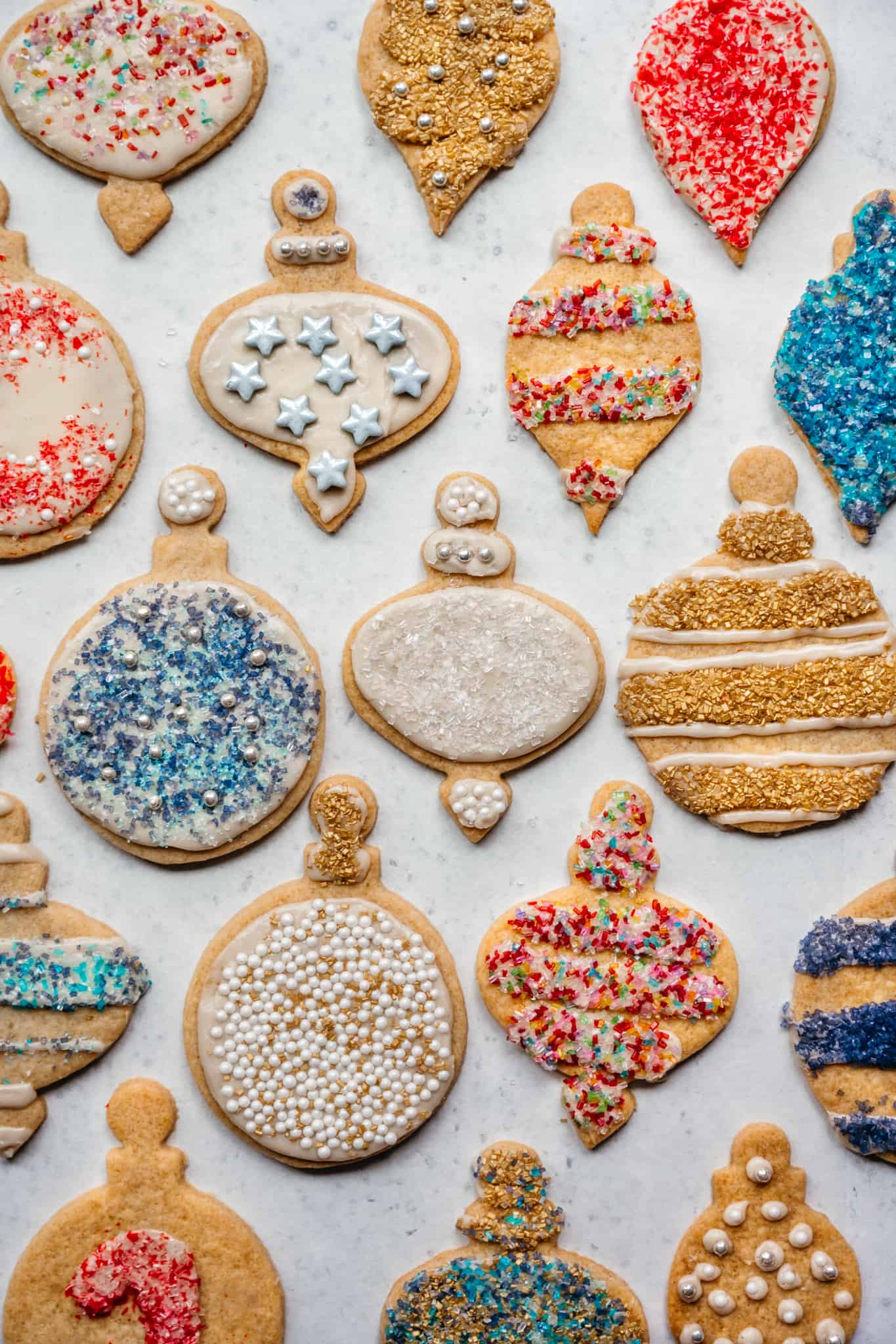 overhead view of vegan gluten free sugar cookies with christmas decorations