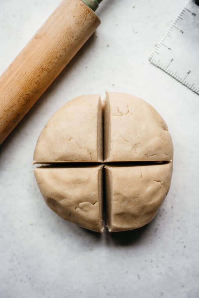 overhead view of sugar cookie dough in 4 portions