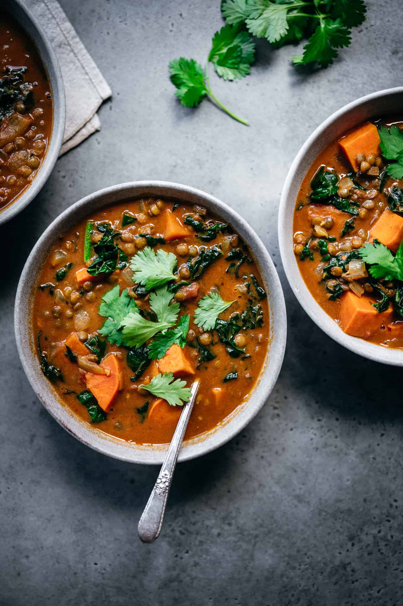 vegan lentil curry sweet potato soup in two bowls