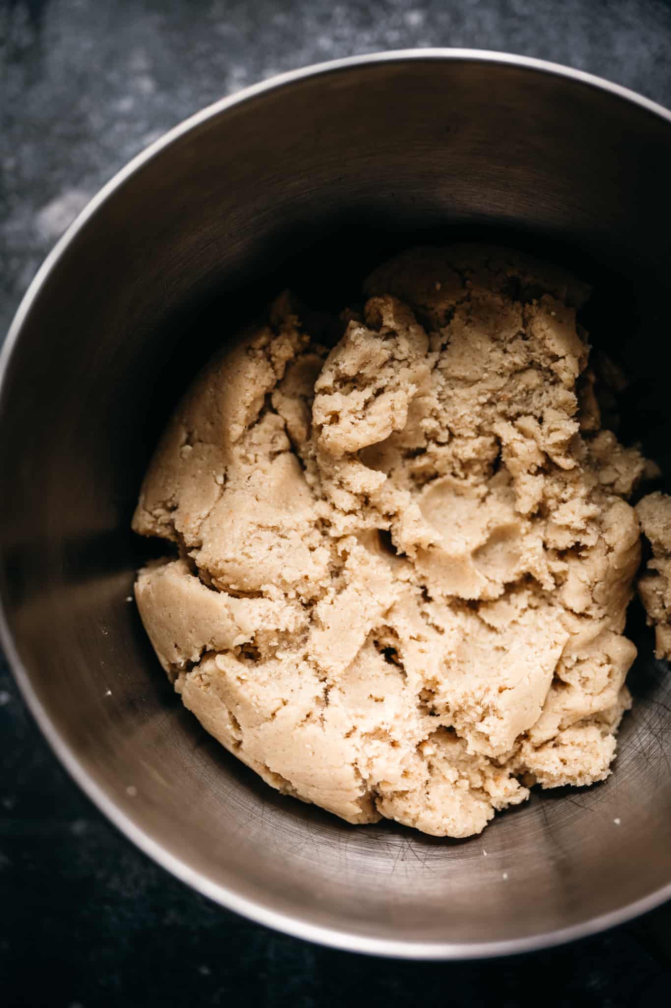 overhead view of linzer cookie dough in a bowl