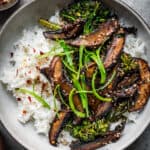 overhead of vegan teriyaki mushroom bowls with white rice and broccolini