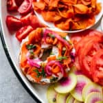 close up overhead of a bagel topped with vegan carrot lox