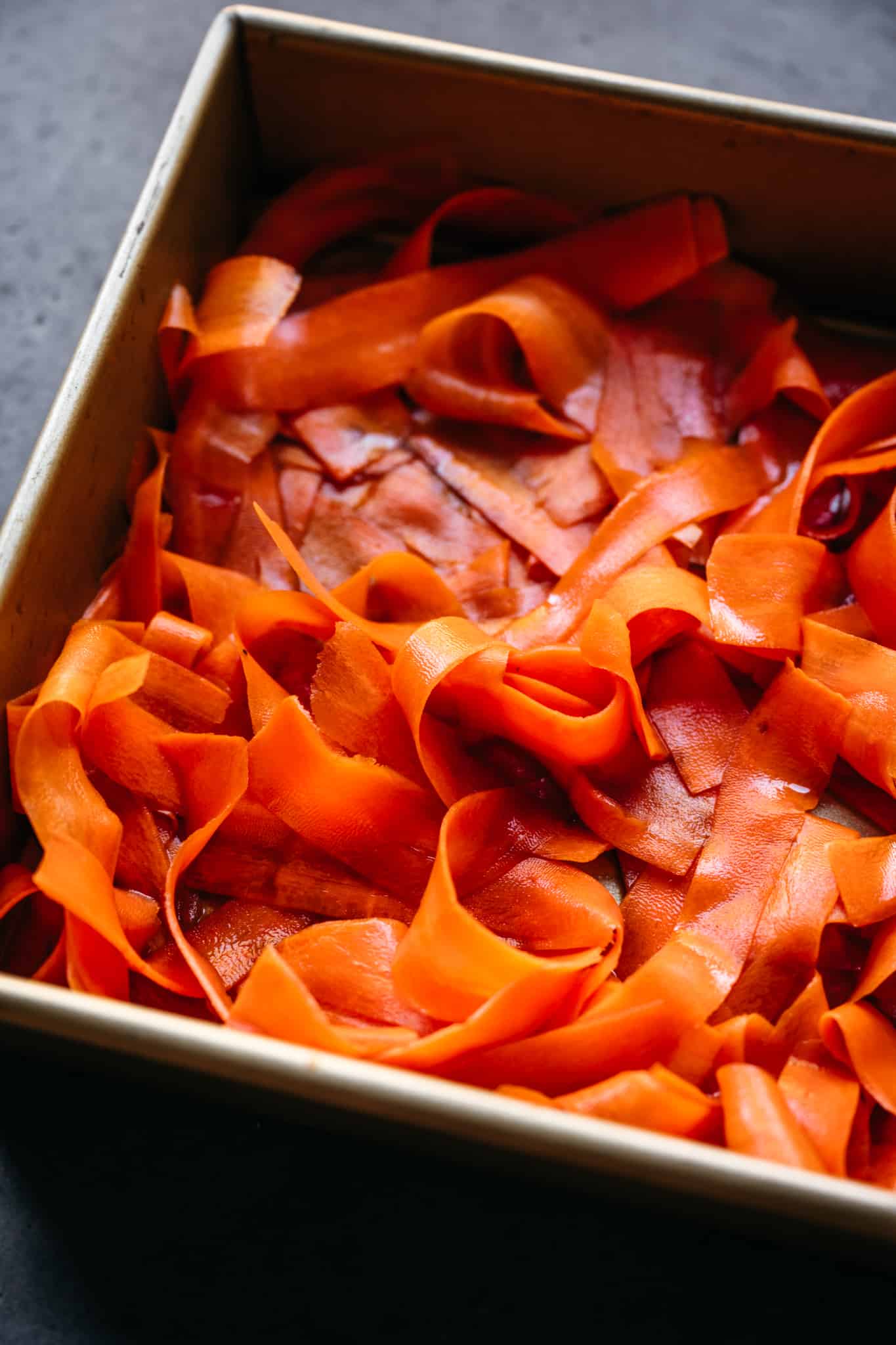 overhead of vegan carrot lox in a square baking dish