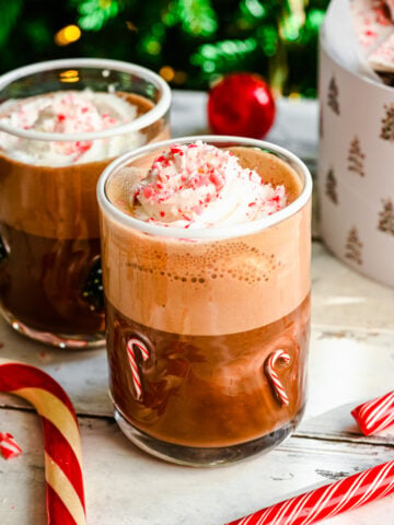 Close up of finished peppermint mochas in festive glasses.