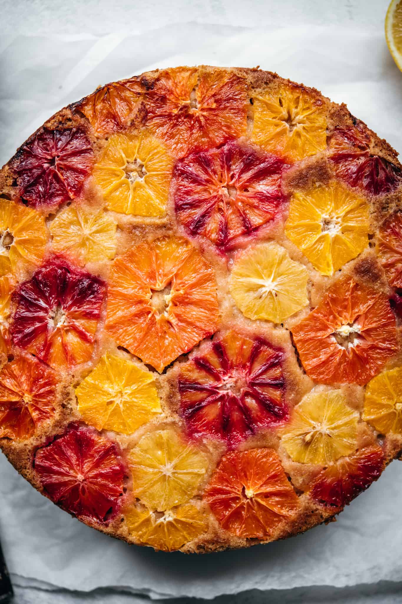 close up overhead view of baked orange olive oil cake