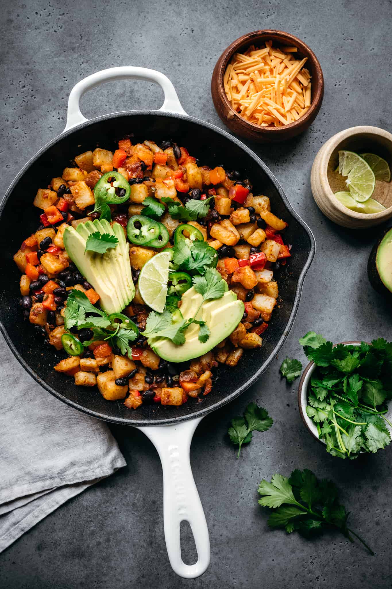 overhead view of vegan breakfast skillet with potatoes and black beans