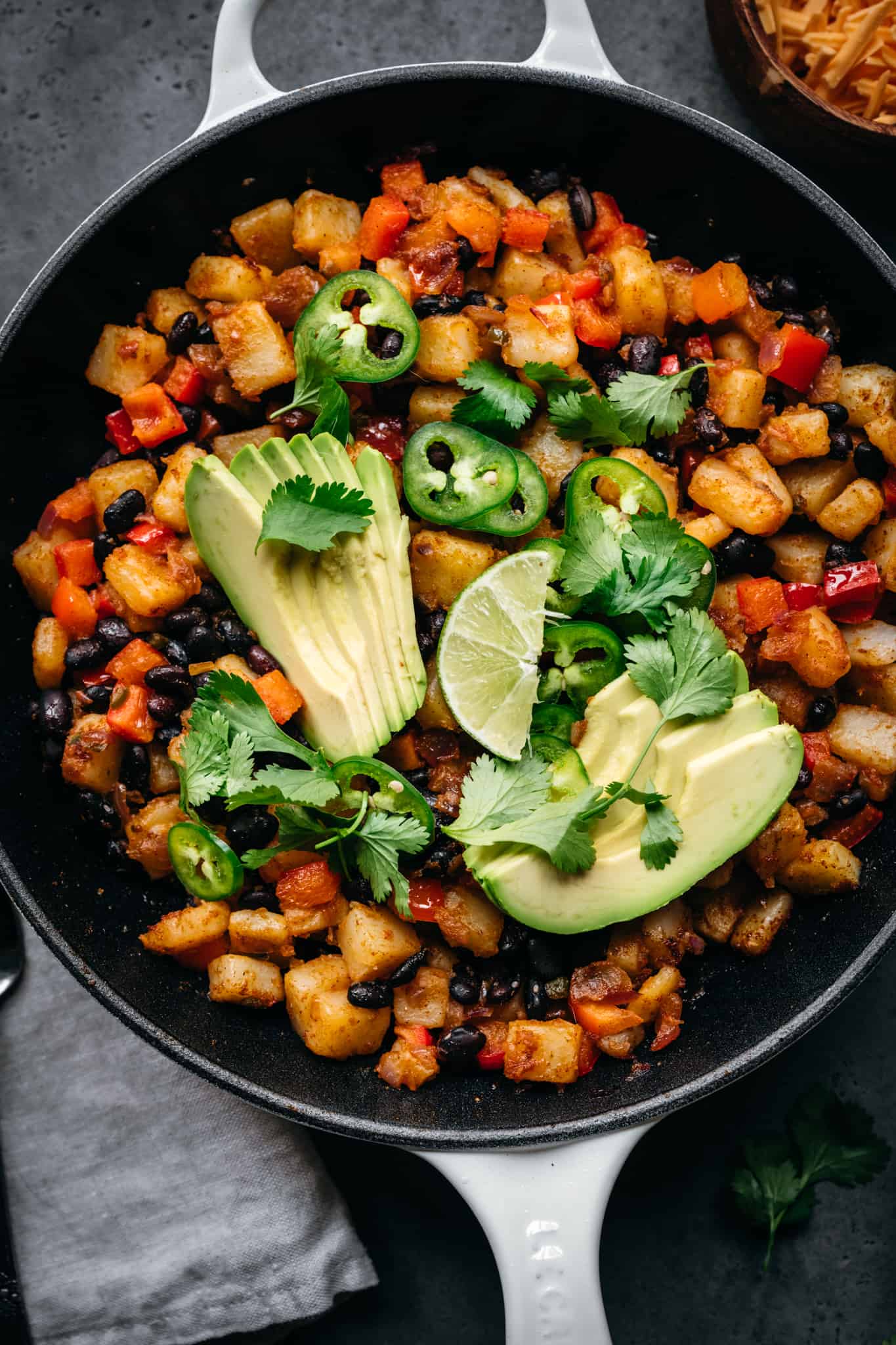 close up overhead of vegan southwest breakfast skillet with avocado