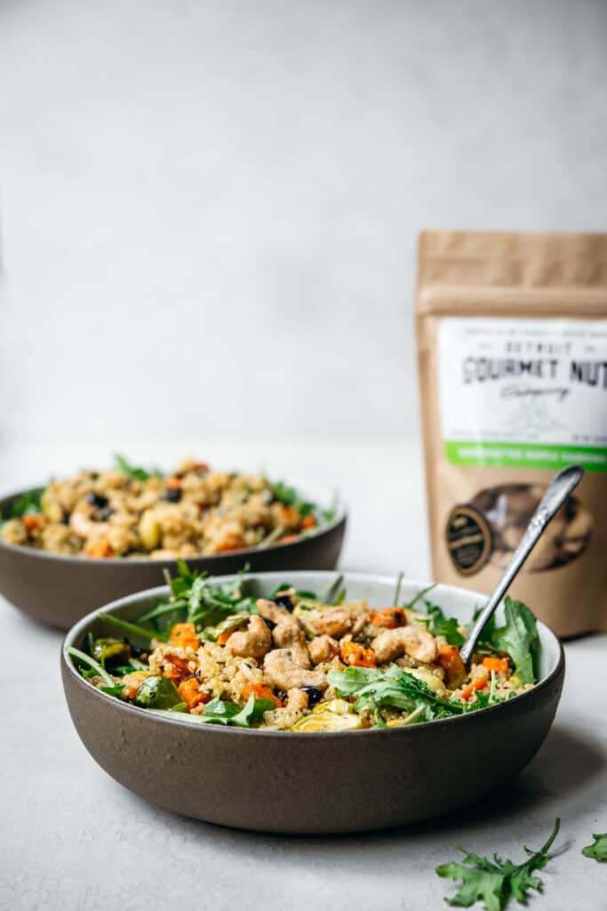 side view of vegan quinoa salad with vegetables and cashews