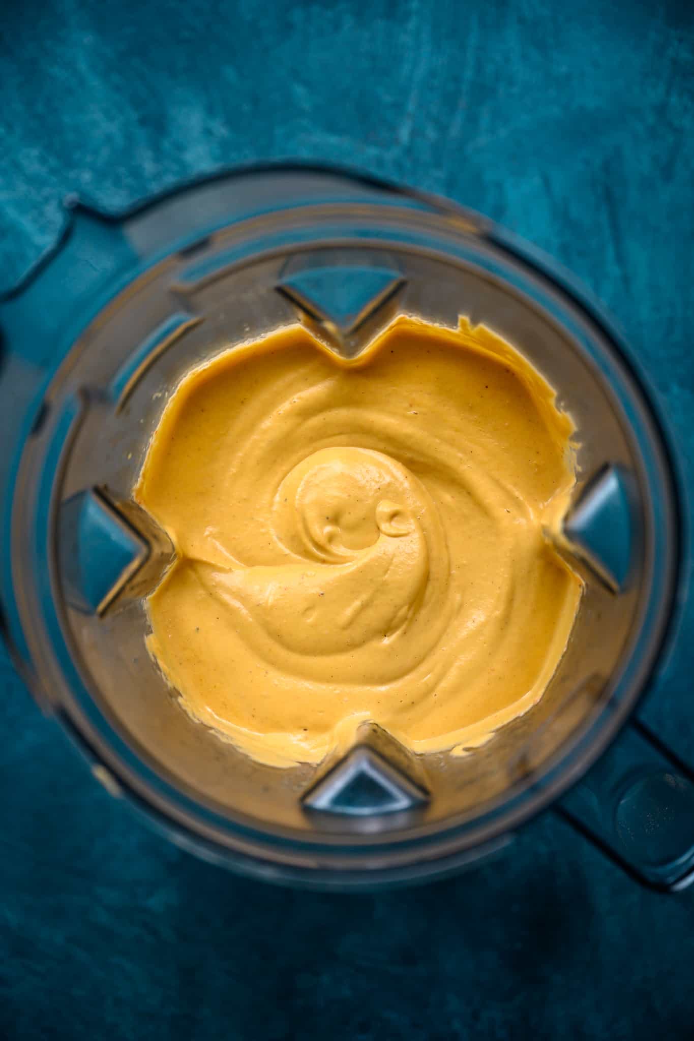 overhead view of vegan queso dip in blender