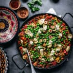 Vegan paella in a pan seen from above.