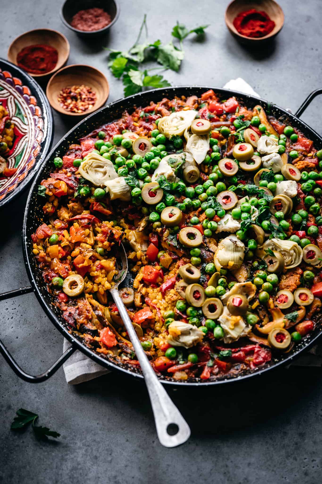side view of vegan paella with vegetables in pan