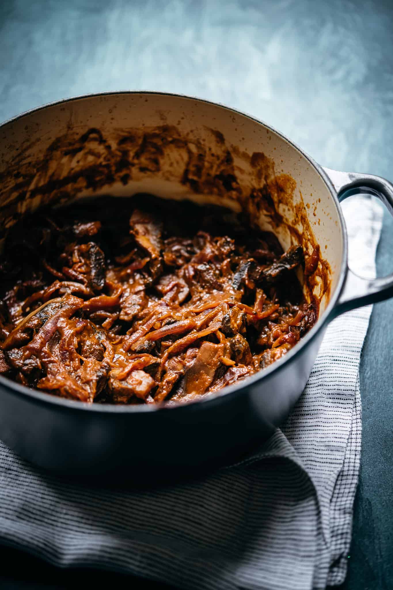 side view of vegan mushrooms al pastor in stock pot