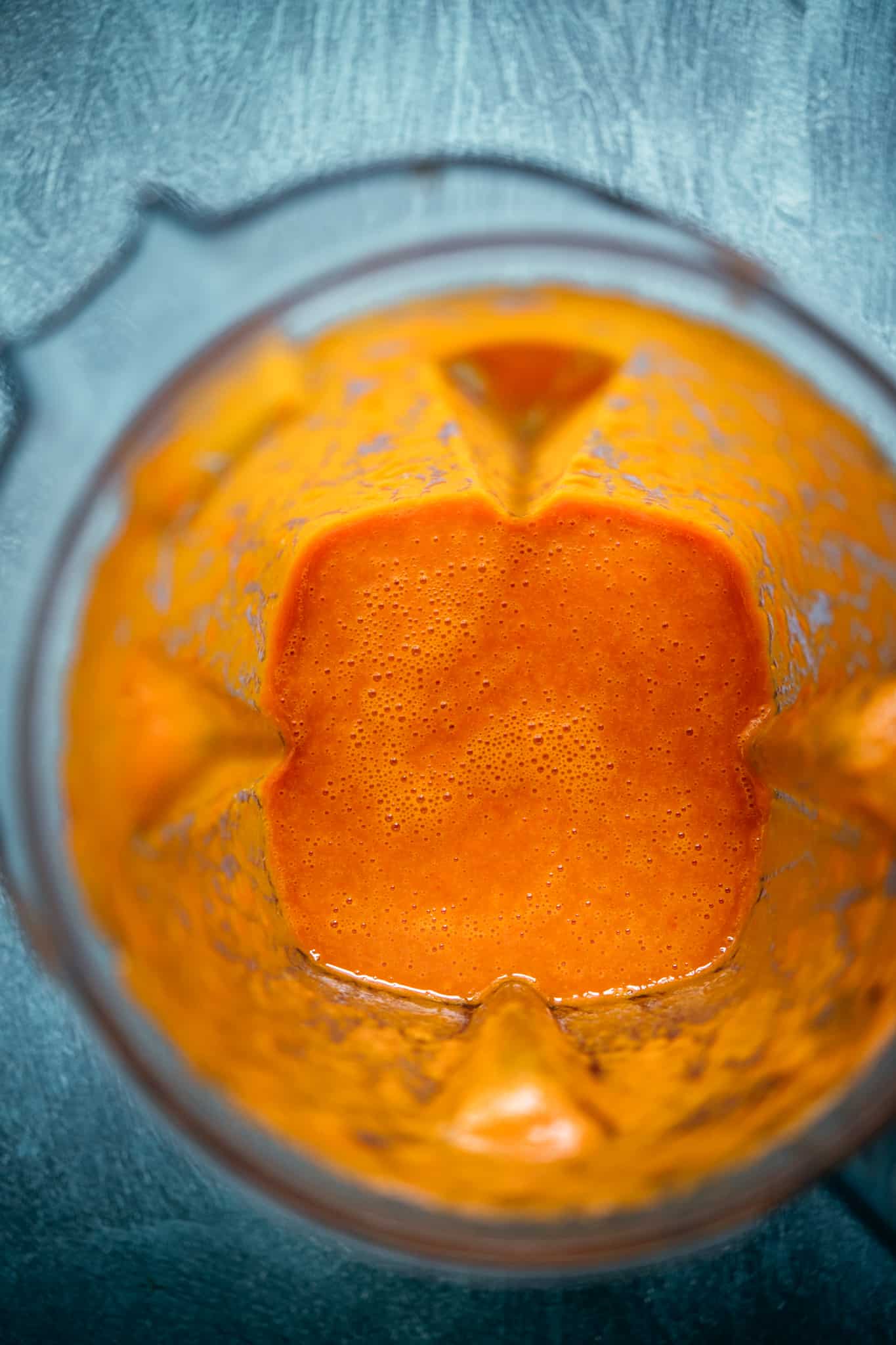 overhead view of sauce for al pastor tacos in a blender