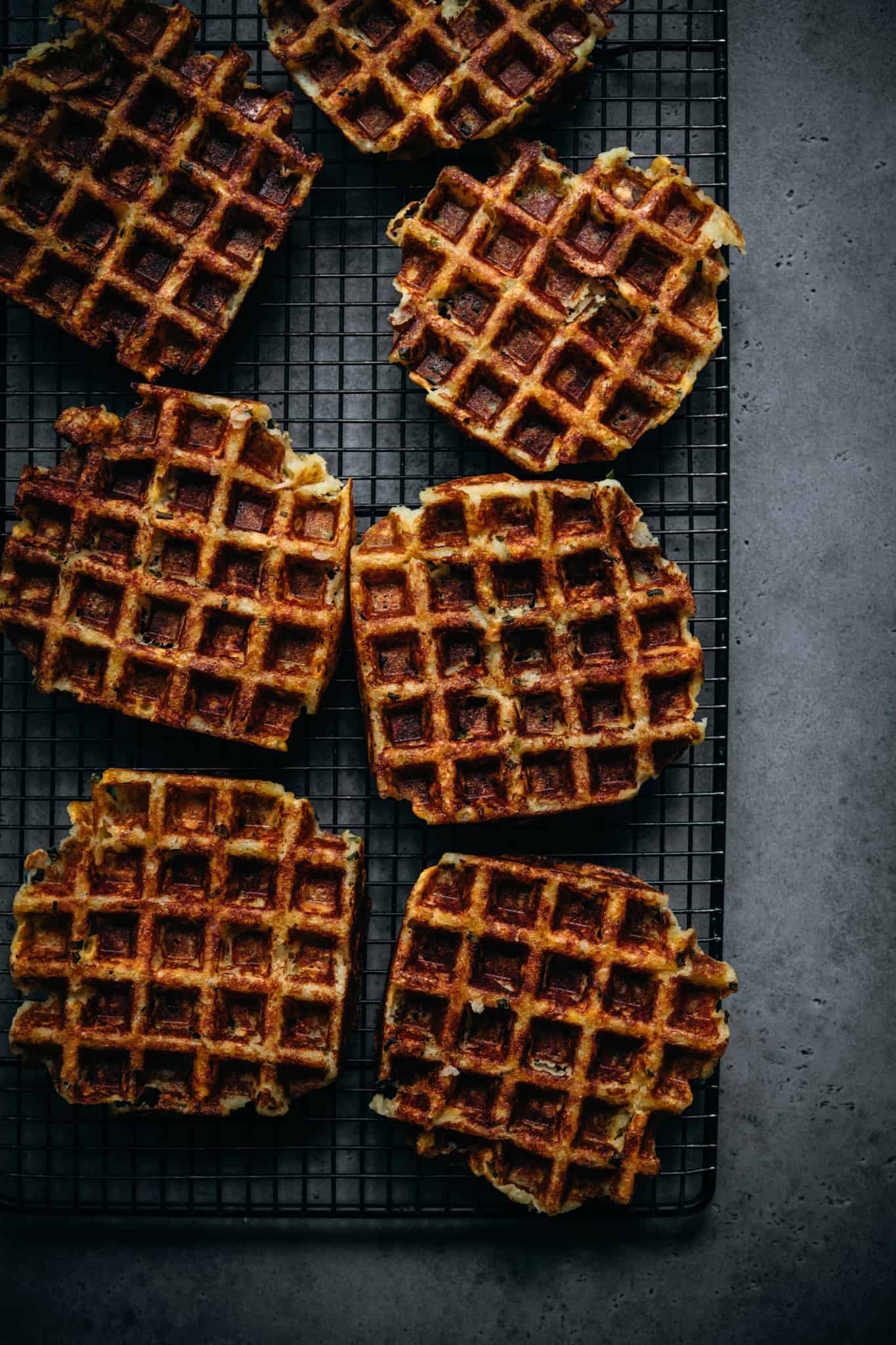 overhead view of crispy mashed potato waffles on cooling rack