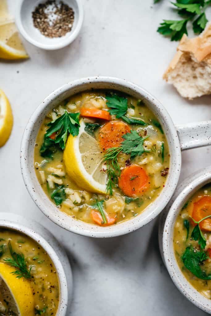 close up overhead view of lemon rice soup in white bowl