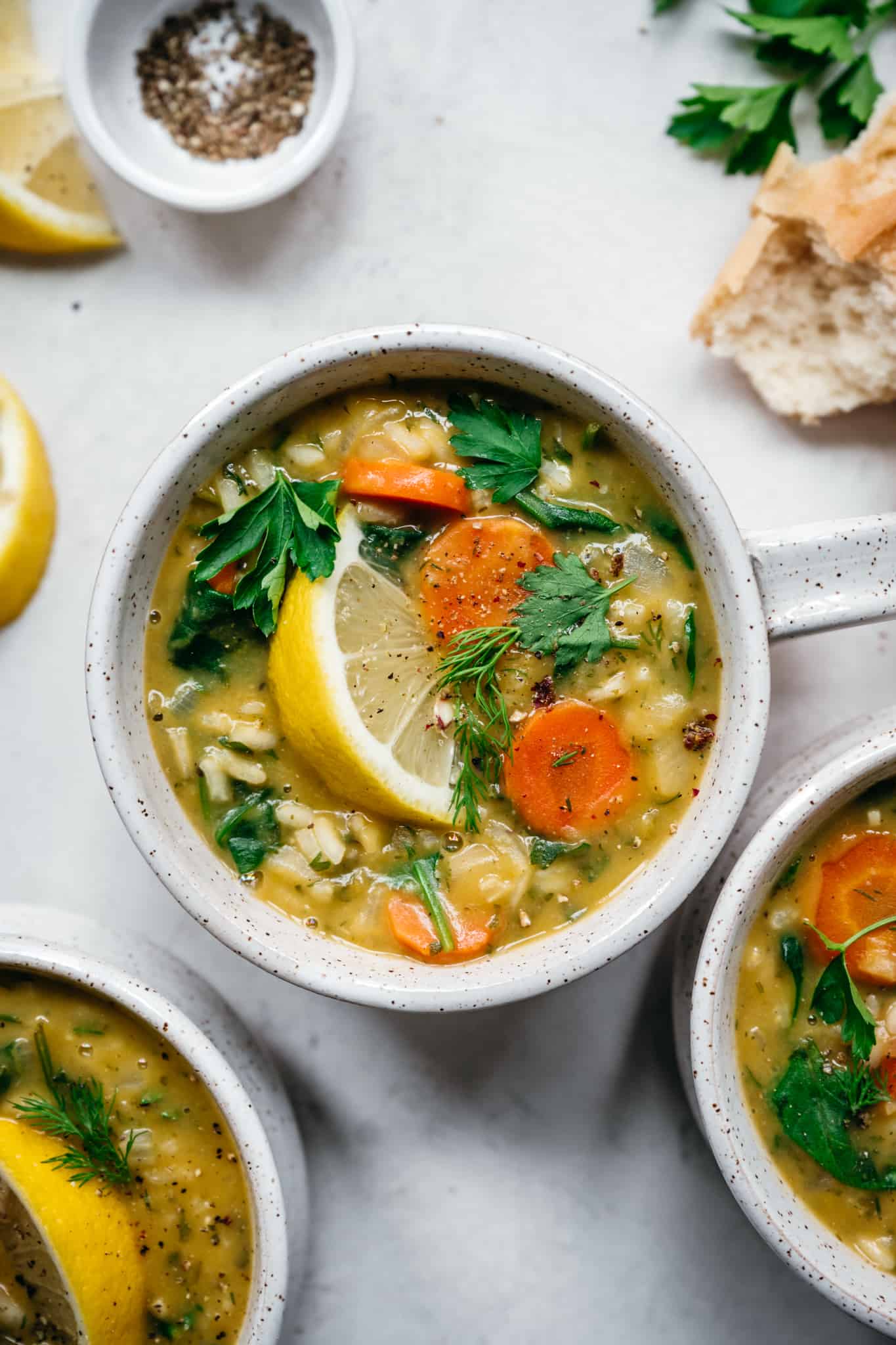 close up overhead view of lemon rice soup in white bowl 