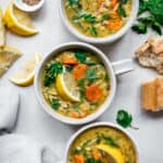 Three bowls of lemon rice soup seen from above.