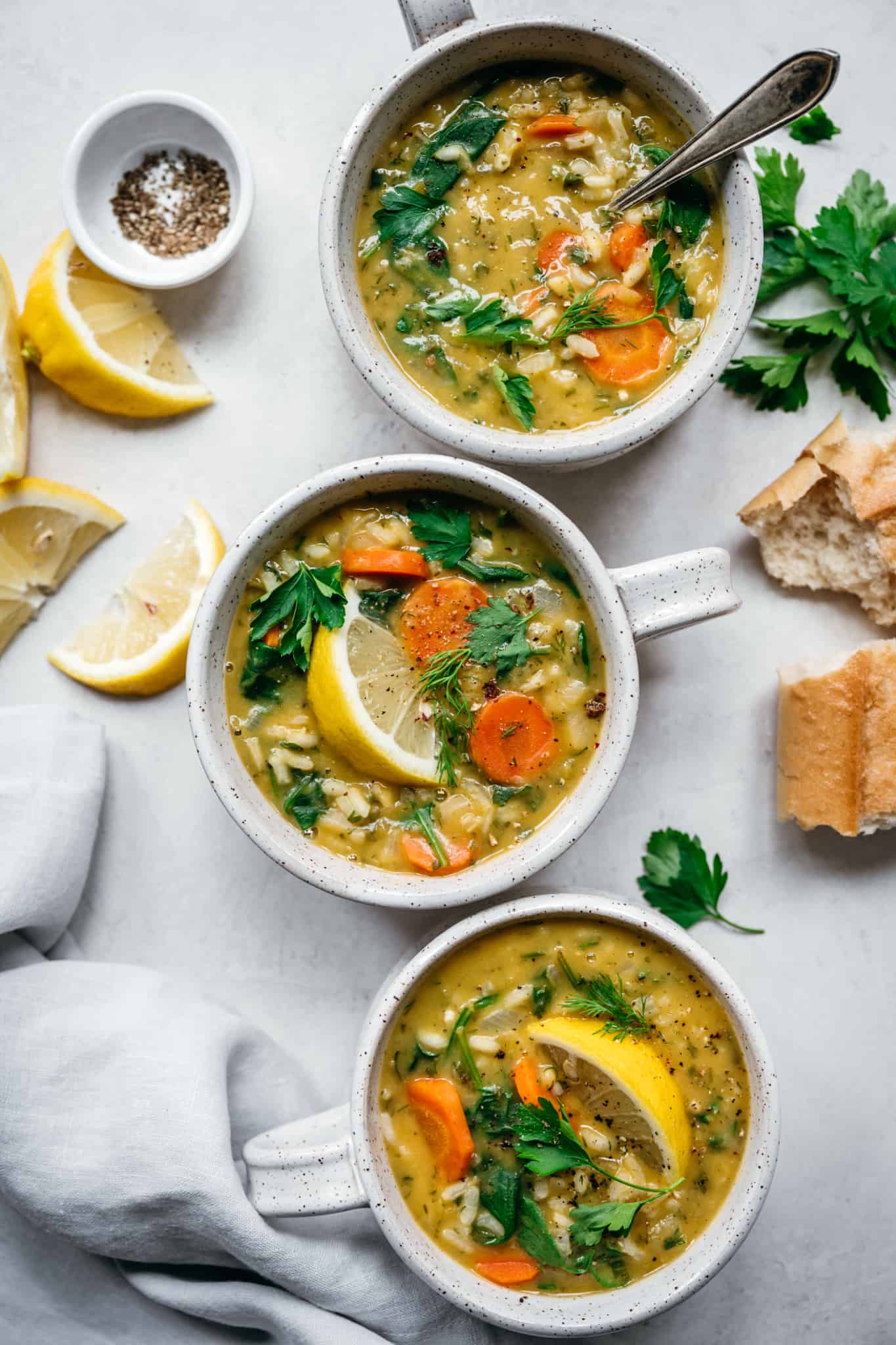 overhead view of vegan lemon rice soup in soup bowls