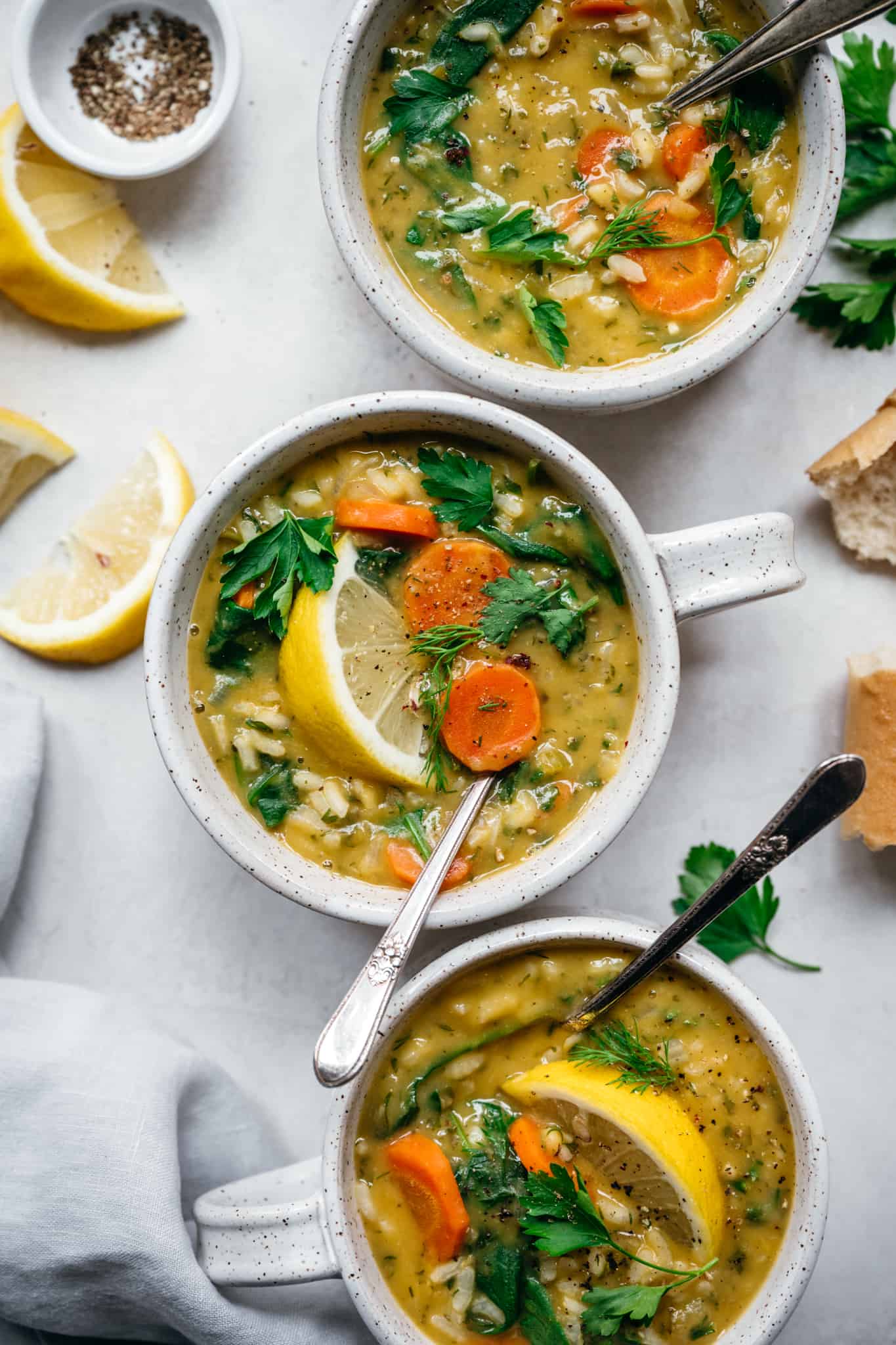 overhead view of vegan lemon rice soup in soup bowls 