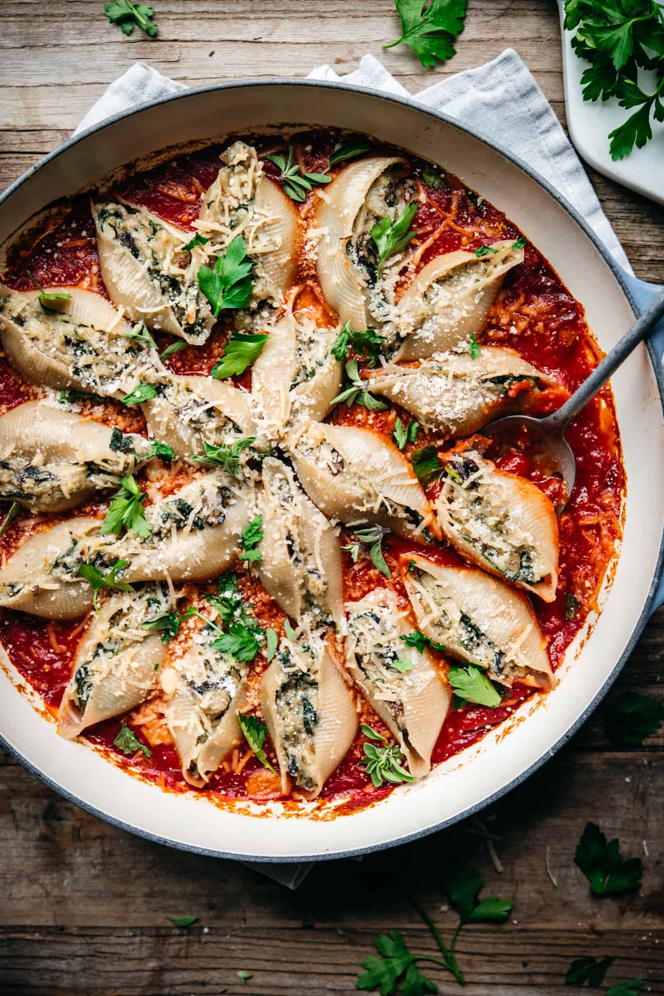 overhead view of vegan stuffed shells in a circular pan