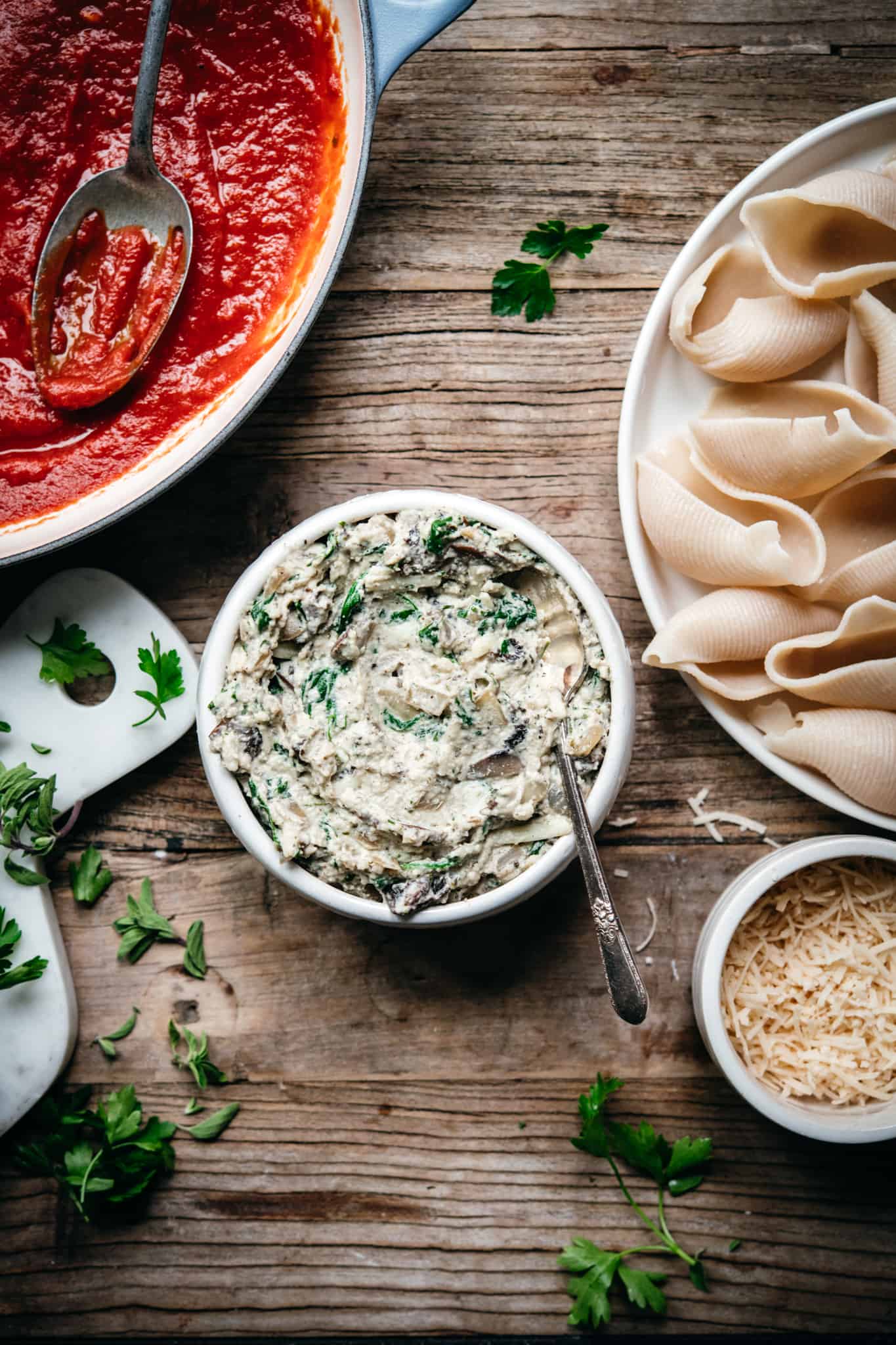 overhead view of vegan ricotta with mushrooms and spinach in a bowl