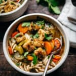 Bowl of tofu noodle soup seen from above.