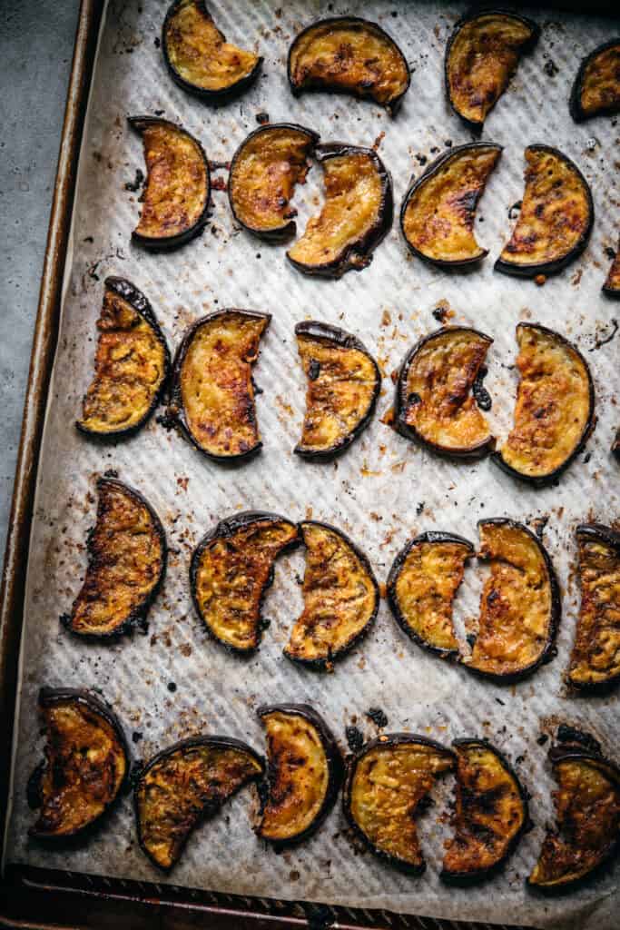overhead view of miso glazed oven roasted eggplant slices on sheet pan