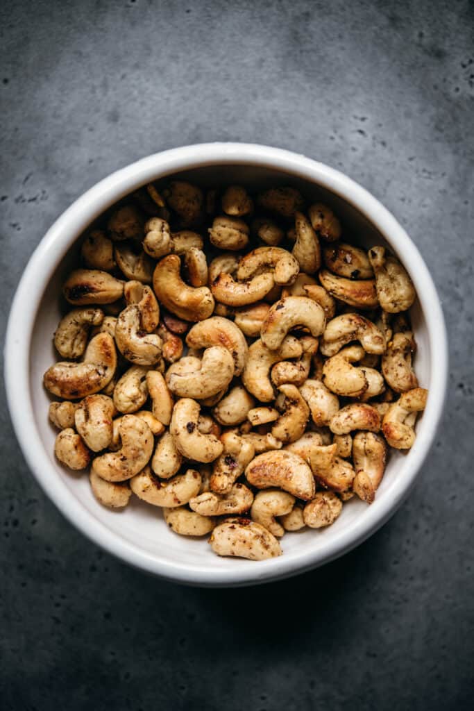 overhead view of bowl with chili garlic cashews