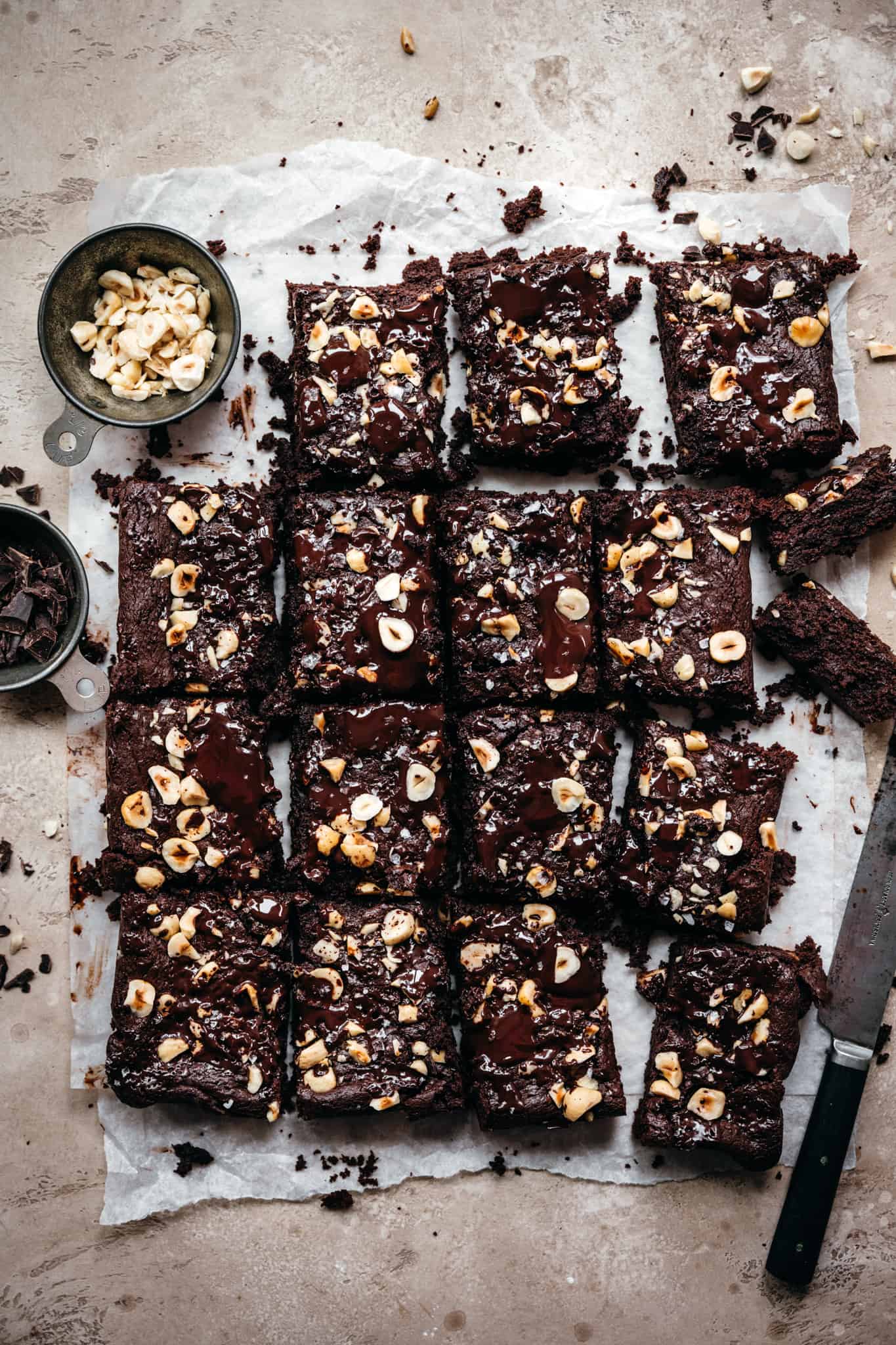 overhead view of hazelnut tahini brownies on parchment paper