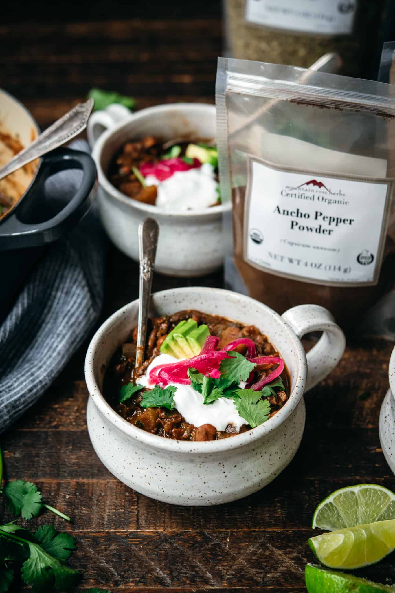 side view of vegan pinto bean chili in bowls