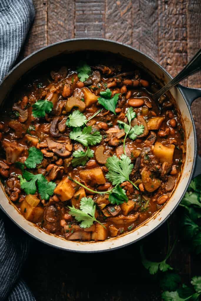 overhead view of vegan pinto bean chili in large pot