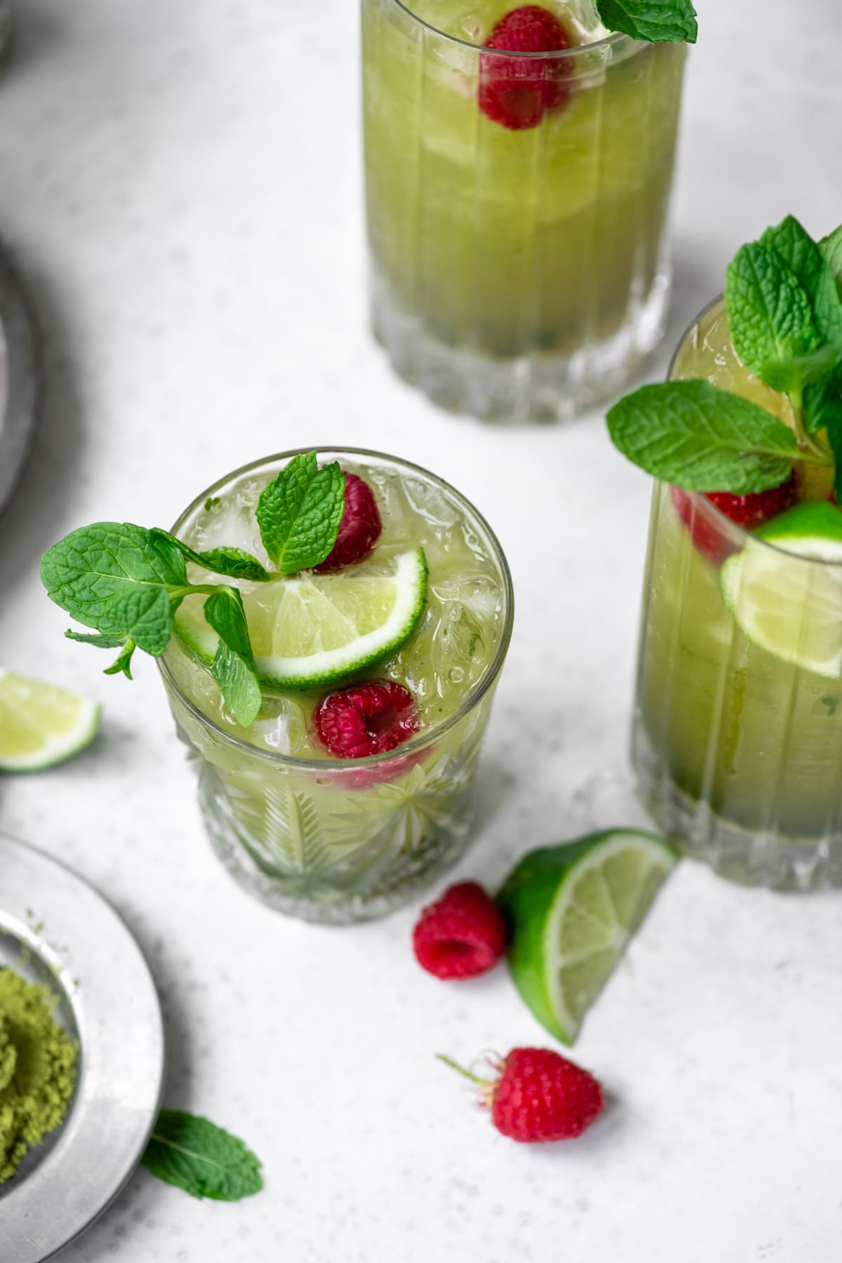 side view of matcha mojito in small glass