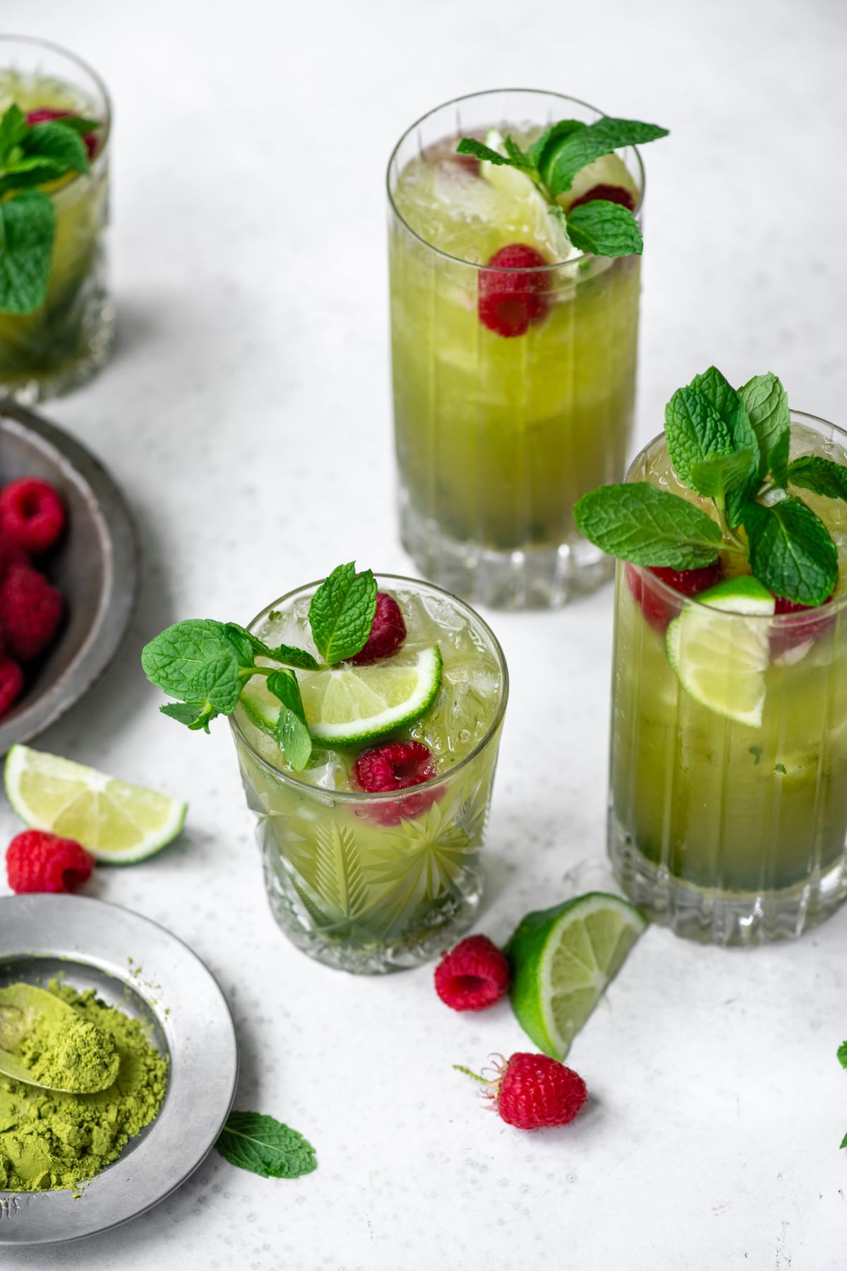 side view of matcha mojitos in highball glasses