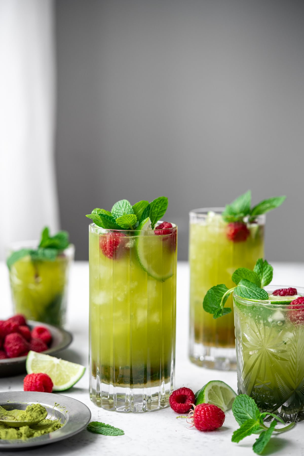 side view of glasses of matcha mojitos