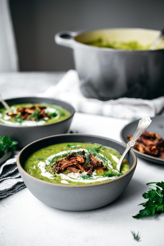 Front view of two bowls of split pea soup in bowls.