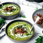 Two bowls of vegan split soup seen from above.