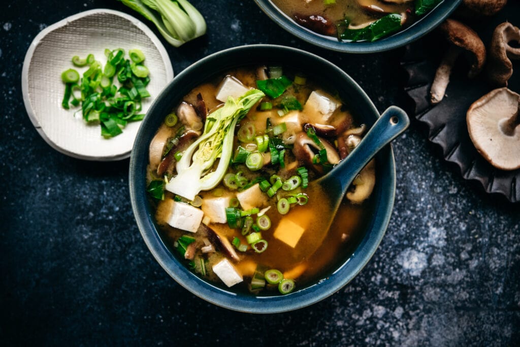 miso soup in a bowl with tofu and scallions