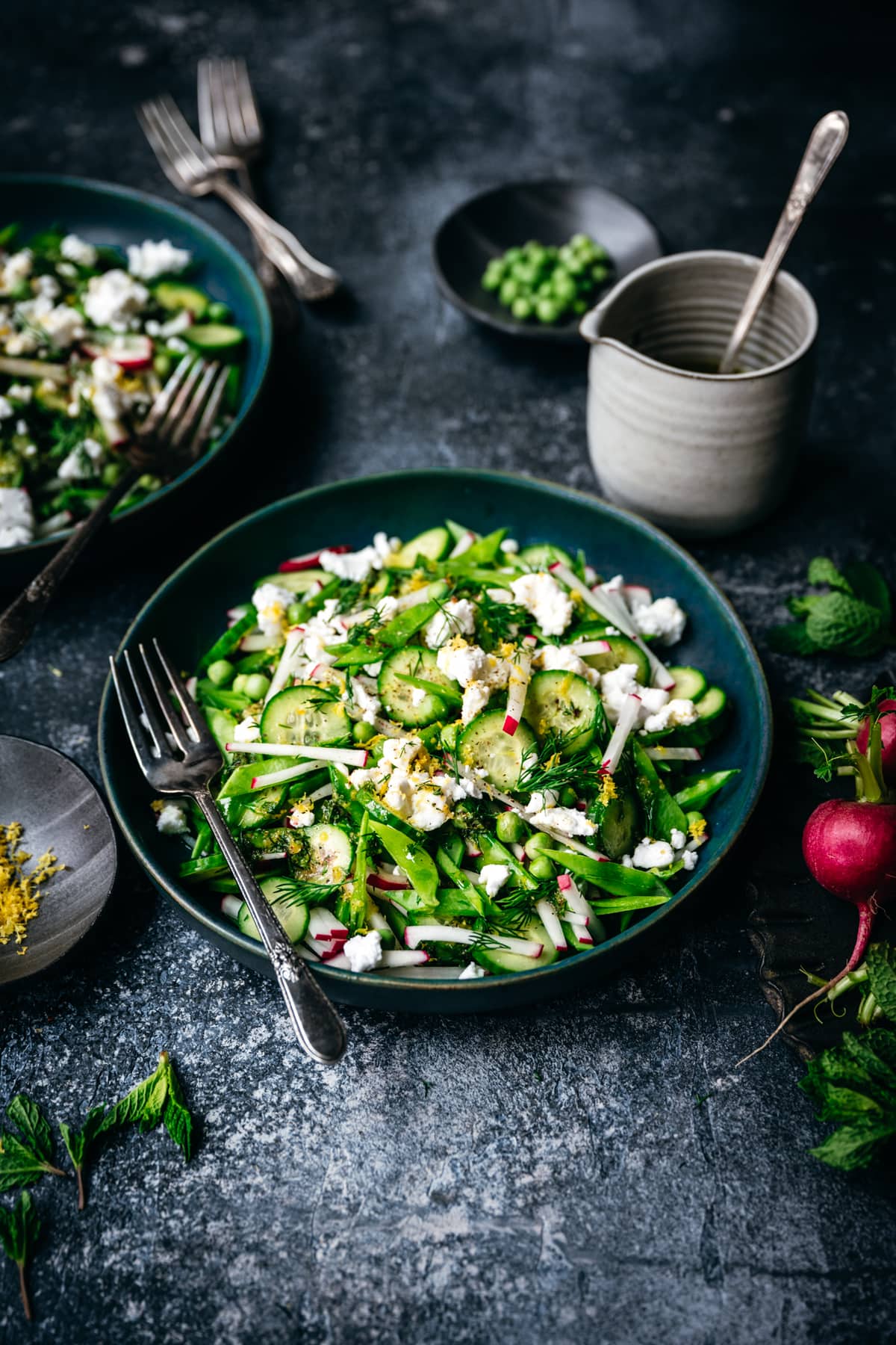 side view of fresh snow pea and radish salad with lemon herb vinaigrette