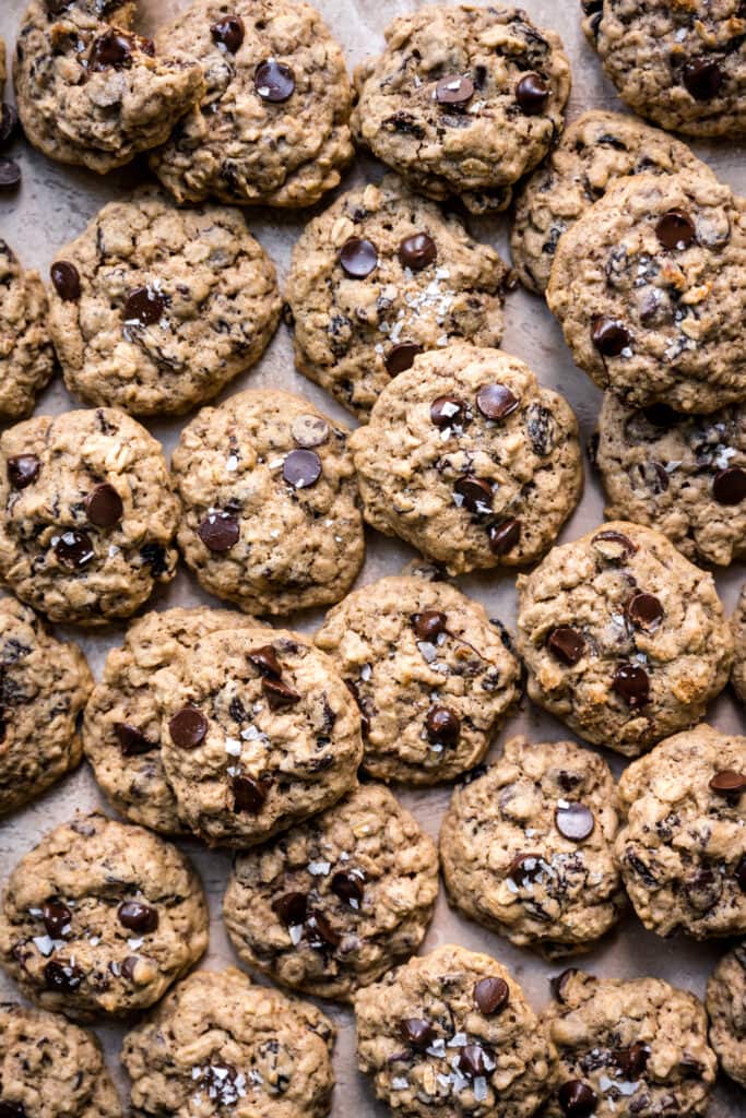 overhead view of gluten free vegan oatmeal raisin chocolate chip
cookies on sheet pan