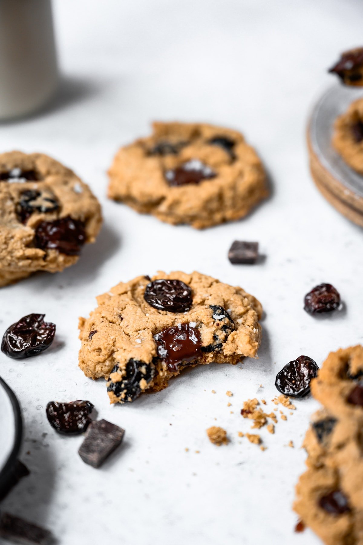 side view of oatmeal tart cherry cookie with bite taken out