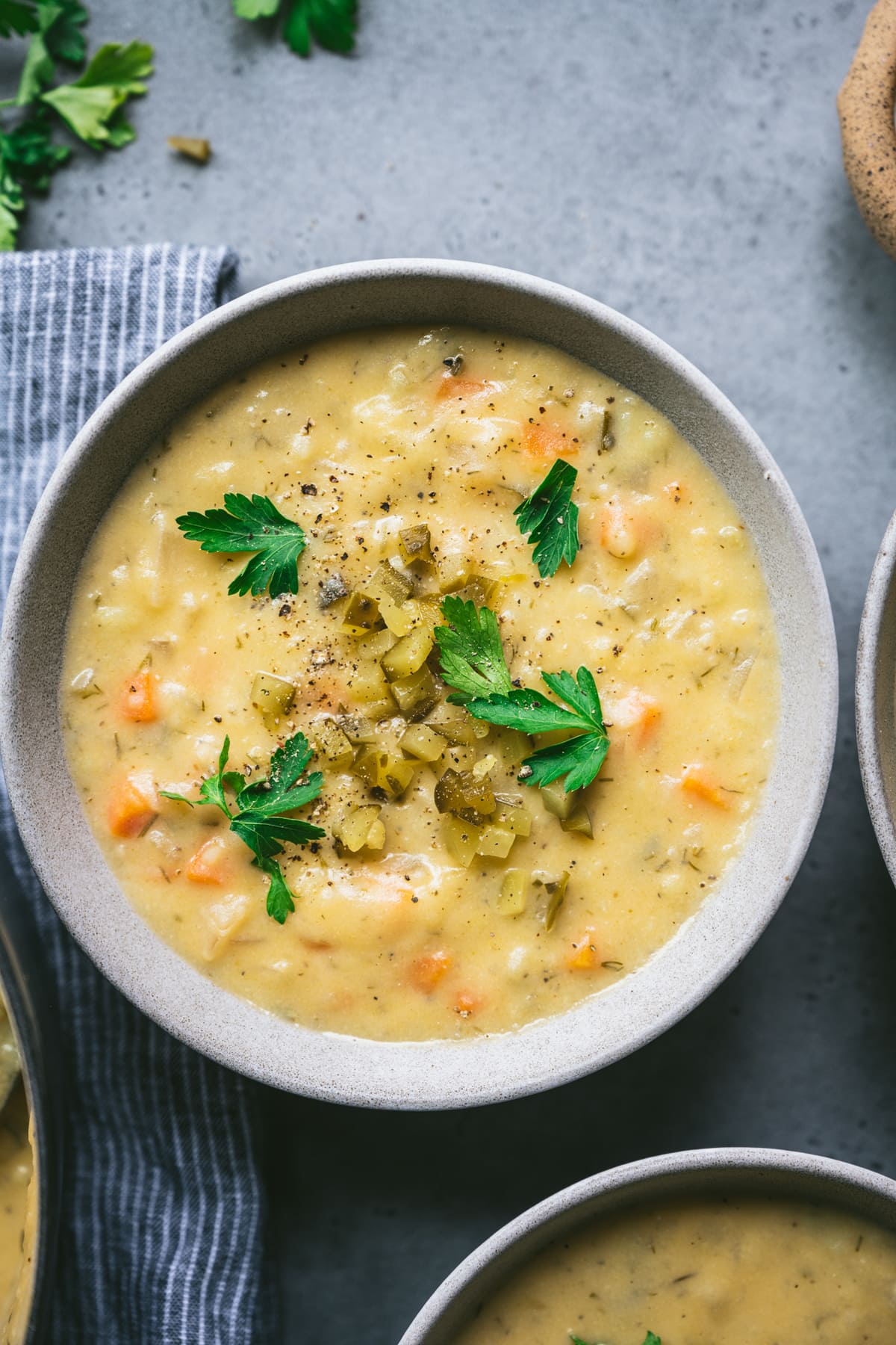 close up overhead view of pickle potato soup in bowl