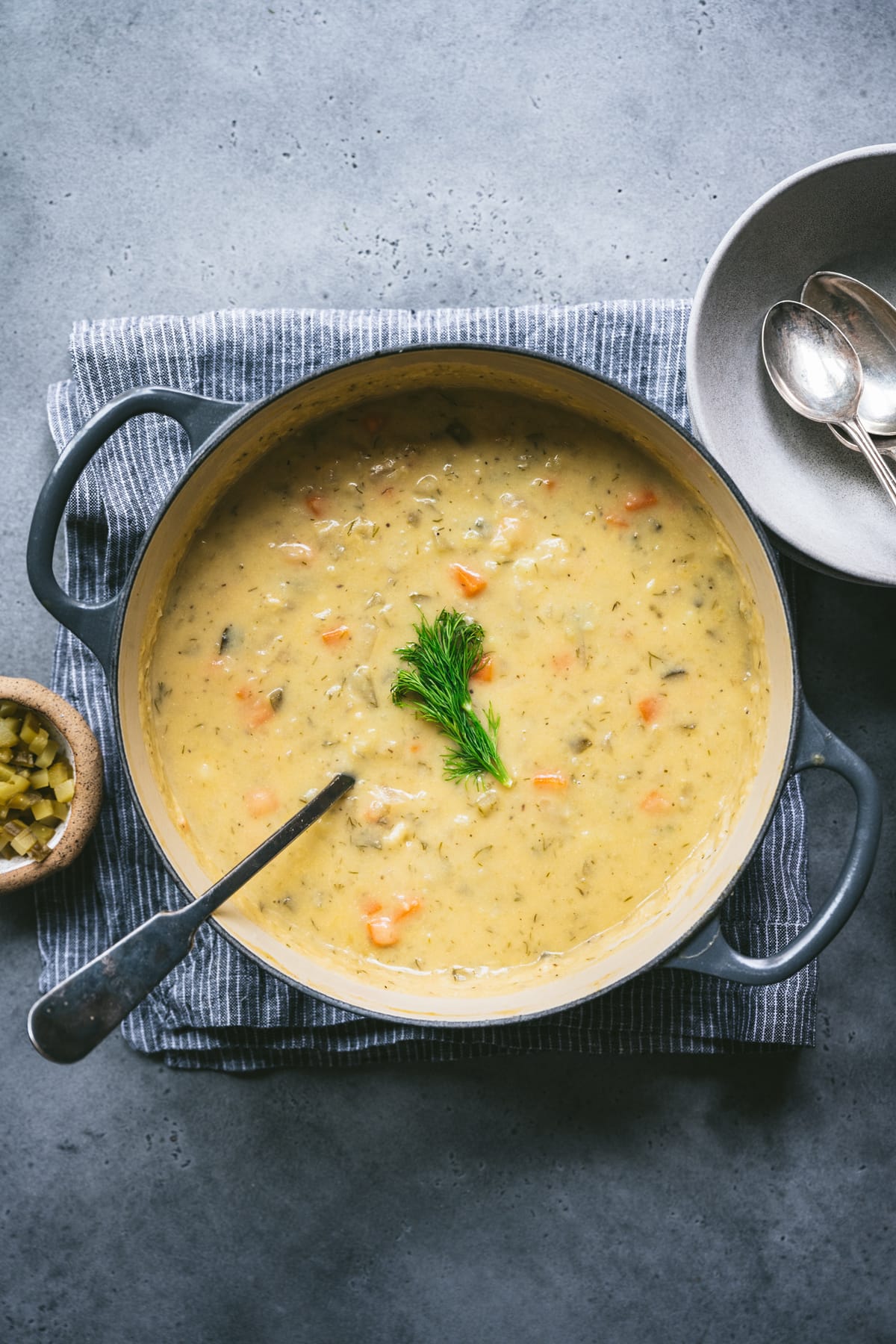 overhead view of vegan dill pickle soup in large pot