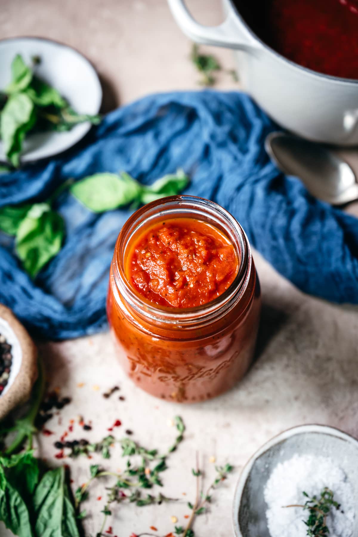 overhead view of homemade tomato sauce in glass jar