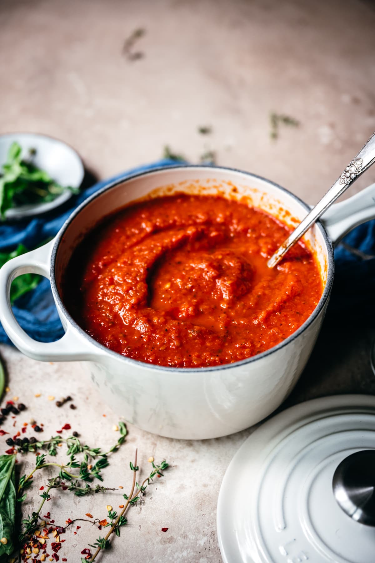 side view of homemade tomato sauce in a white pot